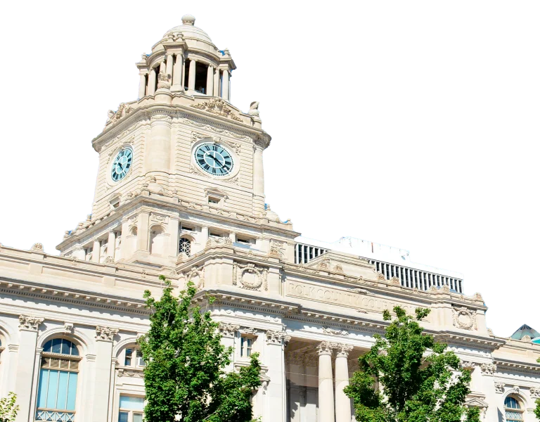 a white building with trees