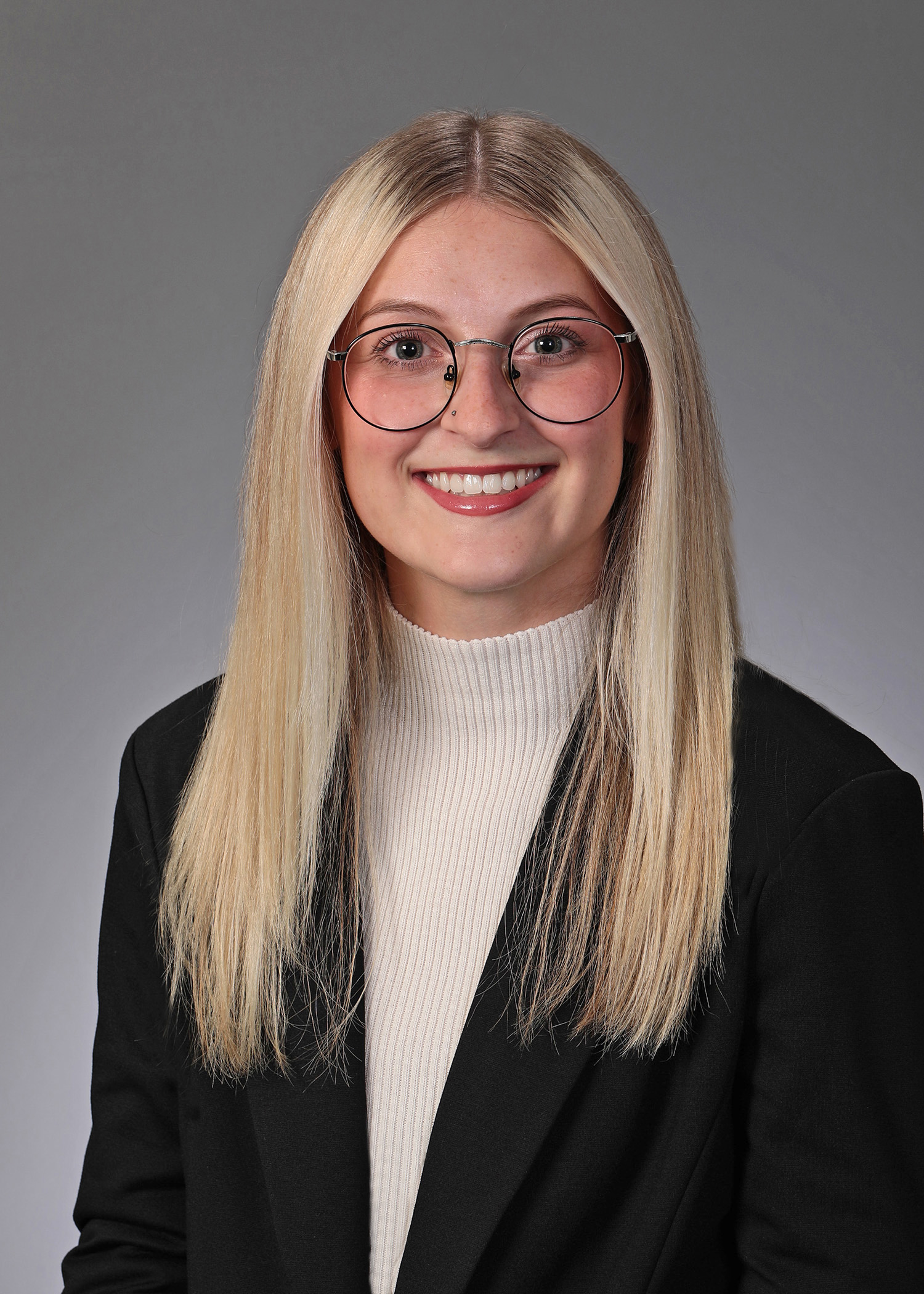 blonde haired woman in glasses