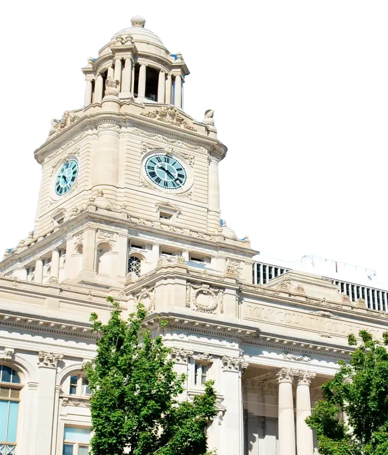 a white building with trees